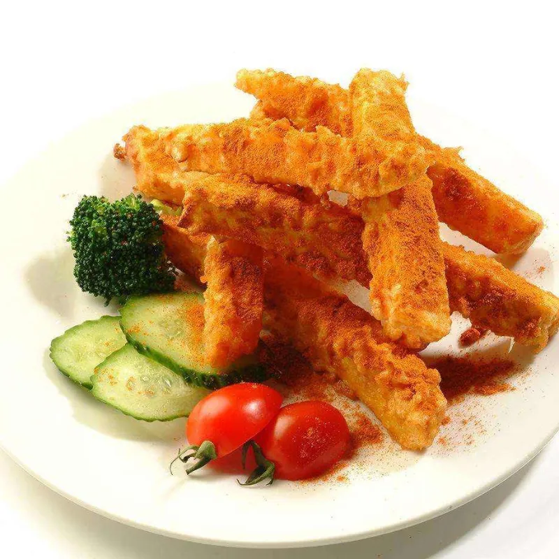 Crispy seasoned fried tofu sticks with fresh vegetable garnishes at Wild Crab House, a Seafood Restaurant in Staten Island