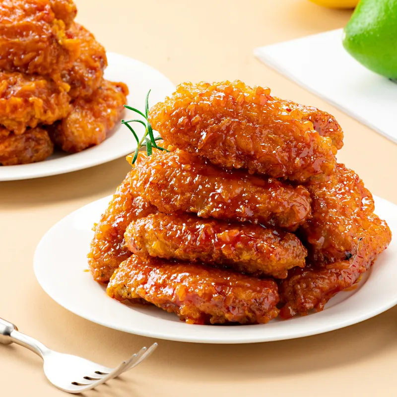 Glossy sweet-spicy sauced crispy fried chicken wings at Wild Crab House, a Seafood Restaurant in Staten Island