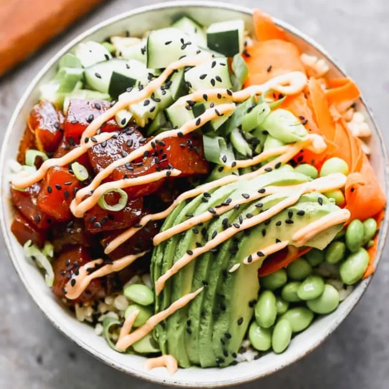 Salmon poke bowl loaded with avocado, edamame and spicy sauce at Wild Crab House, a Seafood Restaurant in Staten Island